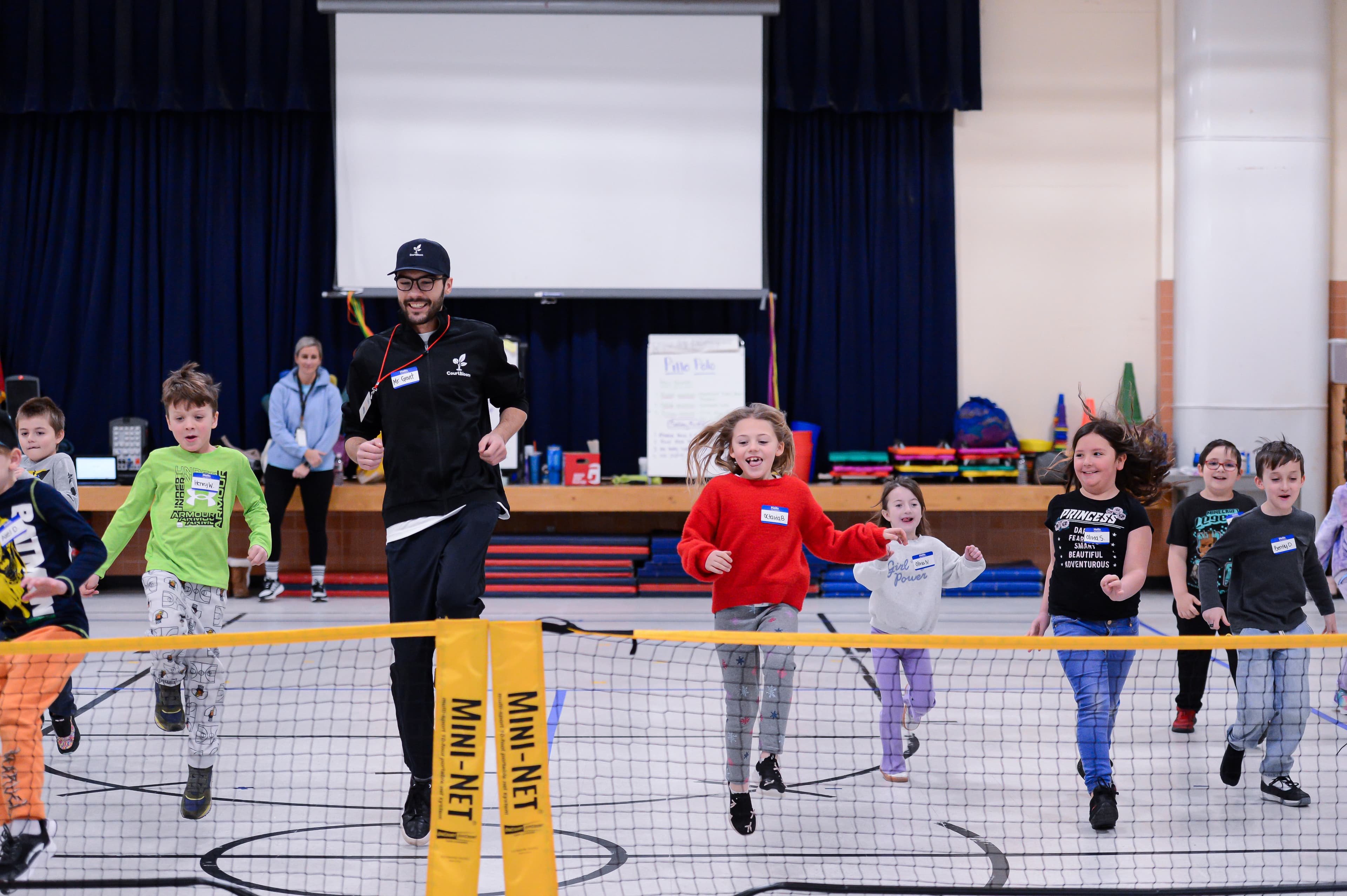 Kids playing tennis at a free CourtBloom session