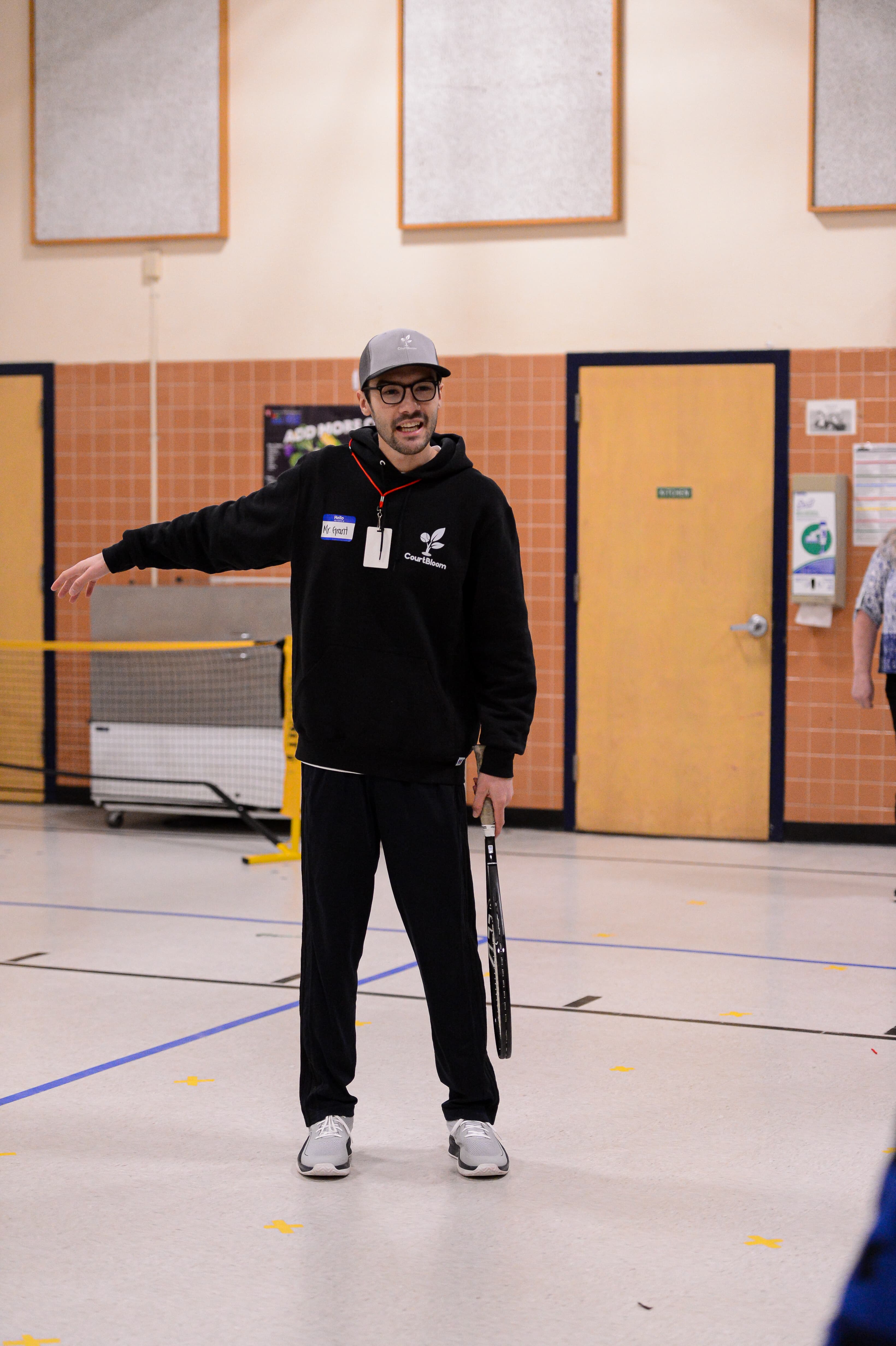 CourtBloom youth tennis photo — action point
