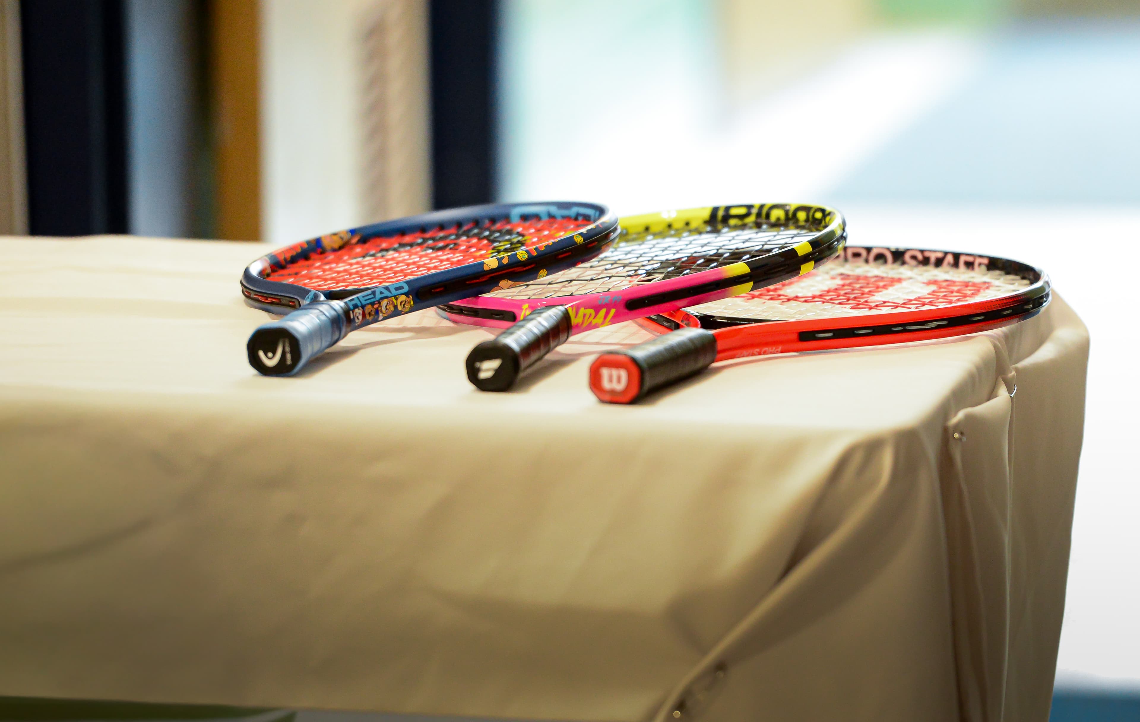 CourtBloom youth tennis photo — rackets photo